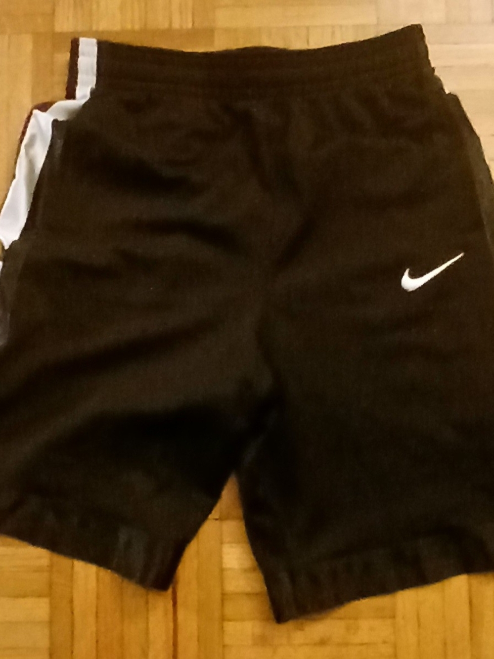 Nike Boys Black Athletic Shorts with White Swoosh and Side Stripe